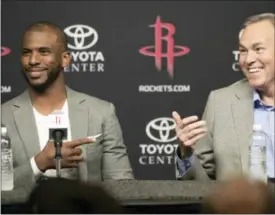  ?? DAVID J. PHILLIP — THE ASSOCIATED PRESS ?? Houston Rockets coach Mike D’Antoni, right, answers a question as Chris Paul, left, reacts during a news conference to introduce Paul as the newest member of the Houston Rockets Friday in Houston. The nine-time All-Star was traded from the Los Angeles...