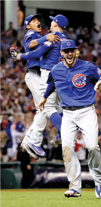  ?? EZRA SHAW/GETTY IMAGES ?? Anthony Rizzo and Kris Bryant prepare to embrace after the Cubs won Game 7 of the 2016 World Series on Nov. 2, 2016, in Cleveland.