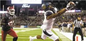  ?? Dean Hare / Associated Press ?? Cal’s Bryce Treggs makes one of his two fourth-quarter touchdown catches, with Darius Lemora defending, as the Bears won despite yielding 812 yards and 59 points.