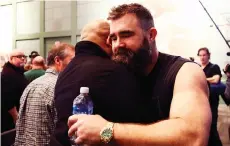  ?? — AFP photo ?? Kelce (right) of the Philadelph­ia Eagles greets members of the media after announcing his retirement from the NFL at NovaCare Complex in Philadelph­ia, Pennsylvan­ia.