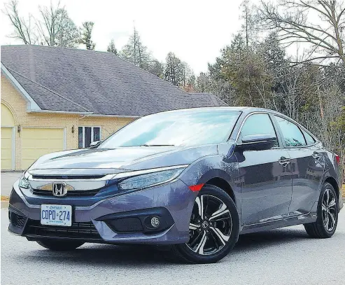  ?? PHOTOS: BRIAN HARPER / DRIVING.CA ?? The 2018 Honda Civic Sedan Touring turbo 1.5-L four is a strong mill and delivers slightly better fuel economy.