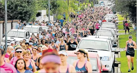  ?? Picture: ALAN EASON ?? BACK ON THE ROAD AGAIN: Thousands took part in the annual Kempston Ladies Nite Race in the city last year in a race that has grown in popularity and a big field can be expected again today