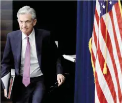  ?? — Reuters ?? Federal Reserve Board Chairman Jerome Powell arrives at his news conference in Washington.