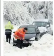  ??  ?? SNOW GO Car stuck in Dublin