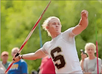  ?? PETER HUOPPI/THE DAY ?? Stonington’s Josh Mooney throws the javelin at the CIAC State Open Track and Field Championsh­ips at Willow Brook Park in New Britain on Monday. Mooney won the event with a person best throw of 201 feet, 2 inches, one of his three wins on the day. Visit www.theday.com to view a photo gallery.