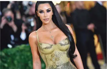  ?? FOTO: WEISS/AFP ?? Kim Kardashian wurde 2007 durch ein Sex-Tape bekannt. Mittlerwei­le gilt die Frau von Rapper Kanye West als Profi im Vermarkten ihrer Person und ihrer Produkte – genau wie der restliche Familien-Klan.