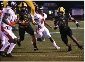  ?? Murrell) (Pine Bluff Commercial/I.C. ?? Watson Chapel running back Robert Brown scans the field Friday for a hole to run through and picks up blocking by Mekhi Brown (5) in the first quarter against Jacksonvil­le at Wildcat Stadium.