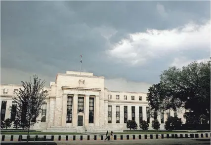  ?? JIM BOURG/REUTERS FILE ?? Analysts and investors have been steadily marking down the likelihood and timing of rate cuts by the Federal Reserve.
