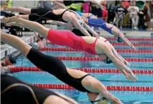  ?? STuART CAHILL / HeRALd STAFF FILe ?? FLOATING IDEAS: A heat of swimmers dive in for the 100 freestyle at the Girls Division 2 Swimming championsh­ips at Boston University on Feb. 15.