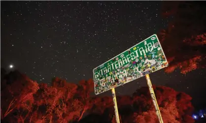  ??  ?? A sign advertises state route 375 as the Extraterre­strial Highway in Crystal Springs, Nevada, near the once top-secret Area 51 military base.
Photograph: John Locher/AP