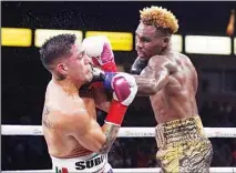  ?? ?? Jermell Charlo (right), lands a shot to Brian Castano during a super welterweig­ht boxing title bout Saturday in Carson, Calif. (AP)