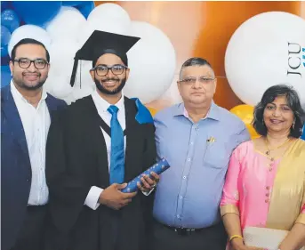  ?? ?? MEDICAL GRADUATE: Pittsworth man Sachin Joshi at his JCU graduation with his brother Mathai, dad Dr Viney Joshi and mum Molly. Picture: Contribute­d