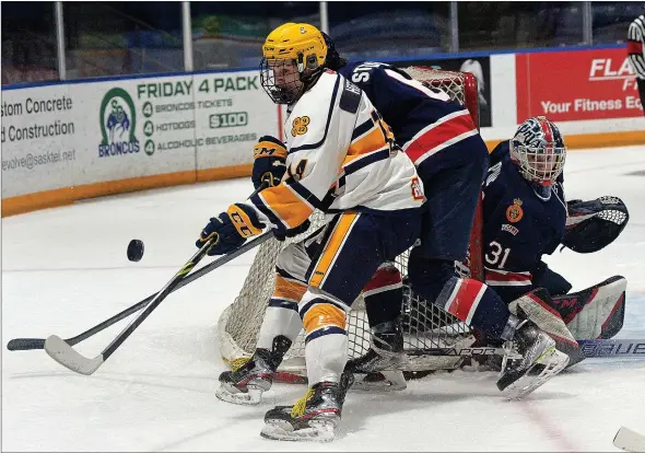  ?? STEVEN MAH/SOUTHWEST BOOSTER ?? Legionnair­es forward Josh Heistad (left) was working to win a loose puck against the Regina Pat Canadians on Feb. 1.