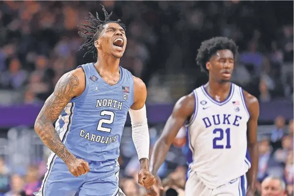  ?? BOB DONNAN/ USA TODAY SPORTS ?? North Carolina’s Caleb Love reacts after a play in the first half Saturday against Duke. The guard scored a game- high 28 points in the Tar Heels’ victory.