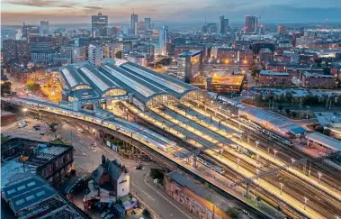  ?? Tom Mcatee ?? An overall view of Manchester Piccadilly at dusk on October 10. While most of the platforms at the stations are contained within the main station building, the busy two through Platforms 13 and 14 (seen from the lower right to the left-hand side of this image) are to undergo major refurbishm­ent works by Network Rail over the Christmas and New Year period.