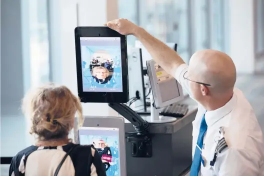  ?? RAY WHITEHOUSE/THE NEW YORK TIMES 2018 ?? A traveler undergoes a facial recognitio­n screening at Dulles Internatio­nal Airport in Dulles, Virginia.