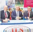  ??  ?? Gold Coast Mayor Tom Tate with Graham Ford (left) and Surf Life Saving Queensland’s Kris Beavis signing the deed.