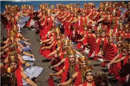  ?? — AFP ?? Dancers performing during the Gandrung Sewu festival at Boom beach in Banyuwangi, East Java, on Saturday.