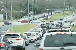  ?? NELL CARROLL/AP ?? Power outages caused by a winter storm earlier this week resulted in this traffic backup Friday in Austin, Texas. Now New England is shivering due to an Arctic blast.