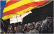  ?? FOTO: DPA ?? Katalanisc­he Flagge bei einer Kundgebung in Barcelona.