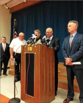  ?? ERIC DEVLIN — DIGITAL FIRST MEDIA ?? Berks County District Attorney John T. Adams reads a statement during an Aug. 15press conference in Leesport regarding the murder-suicide of a Sinking Spring family on Aug. 6.