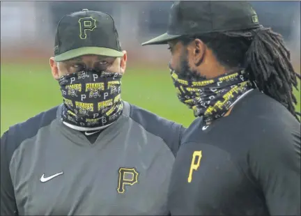  ?? GENE J. PUSKAR - THE ASSOCIATED PRESS ?? In this Tuesday, July 7, 2020, file photo, Pittsburgh Pirates first baseman Josh Bell, right, listens to manager Derek Shelton during a team workout at PNC Park in Pittsburgh. Shelton and other first-year managers are scrambling to make up for lost time.