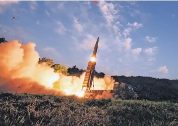  ?? SOUTH KOREA DEFENSE MINISTRY VIA AP ?? South Korea’s Hyunmoo II ballistic missile is fired during an exercise at an undisclose­d location Monday in South Korea. South Korea’s military said it conducted a live-fire exercise simulating an attack on North Korea’s nuclear test site to ‘strongly...