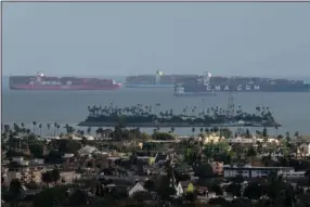  ?? (Bloomberg/Bing Guan) ?? Container ships wait offshore at the Port of Long Beach in March 2021 in Long Beach, Calif.