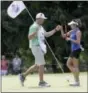  ?? LORI KING — THE ASSOCIATED PRESS ?? Gerina Piller gets congratula­ted by her caddie after making a birdie on the fifth hole at the Marathon Classic on Friday.