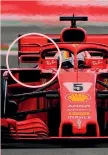  ?? AFP ?? Gli specchiett­i «vietati» montati sulla Ferrari di Sebastian Vettel durante il GP di Spagna