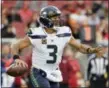  ?? DON FERIA — THE ASSOCIATED PRESS ?? Seahawks quarterbac­k Russell Wilson, here looking for an open receiver against the San Francisco 49ers last Sunday, will be one of the Eagles defense’s stiffest quarterbac­k tests of the season when the teams meet in Seattle this Sunday night.