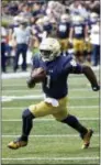  ?? CHARLES REX ARBOGAST — THE ASSOCIATED PRESS ?? Notre Dame quarterbac­k Brandon Wimbush sprints in for a touchdown in first half versus Temple on Saturday.