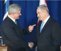  ?? (Ronen Zvulun/Reuters) ?? THEN-CANADIAN prime minister Stephen Harper meets with Prime Minister Benjamin Netanyahu in Jerusalem in 2014.