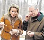  ?? CP PHOTO ?? King Philippe and Queen Mathilde of Belgium sample freshly made maple syrup taffy at Richelieu Park Sugar Shack during a state visit in Ottawa on Monday.