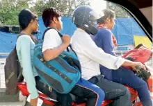  ?? — DC ?? A motorist violates traffic rules by carrying three persons on a motorcycle in Secunderab­ad area on Friday.