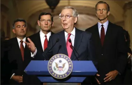  ?? CHIP SOMODEVILL­A, GETTY IMAGES ?? Senate Majority Leader Mitch McConnell talks to reporters with fellow Republican senators at the U.S. Capitol Tuesday. Many Republican and Democratic senators expressed frustratio­n and concern about how President Donald Trump may have shared classified...