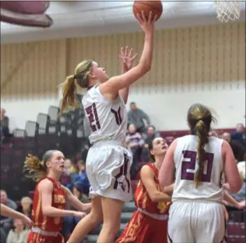  ?? PETE BANNAN — DIGITAL FIRST MEDIA ?? Madi McKee goes in for two of her team-high 13 points to lead Garnet Valley past Haverford in overtime Thursday, 44-40. The win capped an undefeated run through the Central League for the Jaguars.