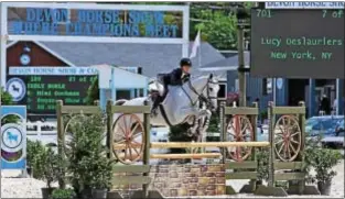  ??  ?? Lucy Deslaurier­s and Class Action winners of the 2016 R.W. Ronnie Mutch Equitation Championsh­ip.