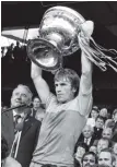  ??  ?? Jimmy Deenihan lifts the Sam Maguire for Kerry in 1981
