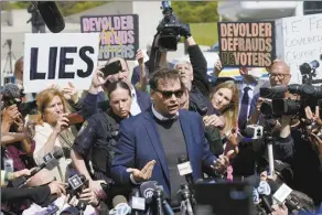  ?? AP photo ?? U.S. Rep. George Santos leaves the federal courthouse in Central Islip, N.Y. on Wednesday. Santos pleaded not guilty to charges alleging a financial fraud at the heart of a political campaign built on dubious boasts about his personal wealth and business success.