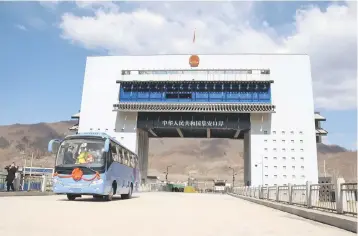  ??  ?? A tour bus driving past the border between China and North Korea as it makes its way to North Korea, in Ji’an in China’s northeaste­rn Jilin province. The new highway border crossing opened in the northeaste­rn city of Ji’an on April 8, complement­ing its three existing ports with the North, the city said in a statement published to its website. – AFP photo