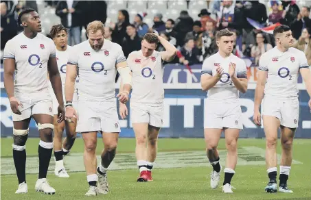  ??  ?? England’s players despair after Saturday’s dismal 6 Nations defeat to France in Paris.