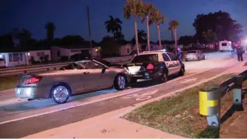  ?? WFOR-CBS 4 ?? A motorist crashed into a Miramar police car at about 6 a.m. Friday that was on scene during an investigat­ion of another crash where a vehicle slammed into a home in the 6600 block of Miramar Parkway several hours earlier.