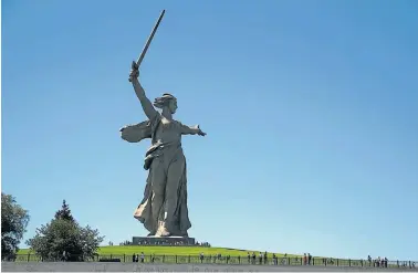  ?? AP/ /THANASSIS STAVRAKIS ?? Tourists visit The Motherland Calls monument in Volgograd, Russia, which commemorat­es the victims of the Battle of Stalingrad, in which the Red Army turned back Nazi Germany’s army.