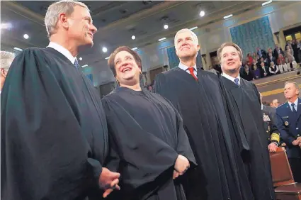  ?? LEAH MILLIS/REUTERS ?? From left, Supreme Court Chief Justice John Roberts, Associate Justice Elena Kagan, Associate Justice Neil Gorsuch and Associate Justice Brett Kavanaugh, in February.
