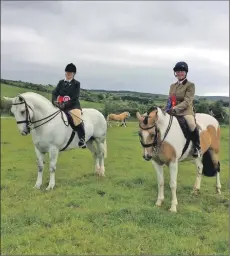  ??  ?? Overall champion Janis Murchie on Island Boy, left, and reserve champion Tracy Warwick on Grants Town Unique.