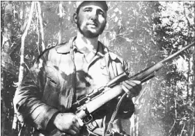  ?? THE ASSOCIATED PRESS FILE PHOTO ?? In this Feb. 26, 1957, photo, Cuba’s leader Fidel Castro stands in an unknown location in Cuba.