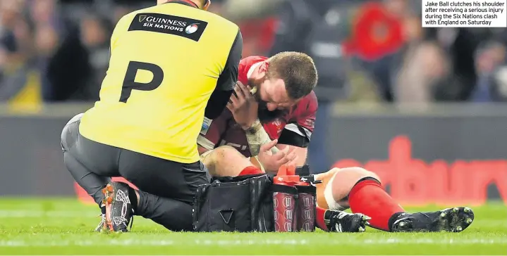  ??  ?? Jake Ball clutches his shoulder after receiving a serious injury during the Six Nations clash with England on Saturday