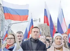  ?? — AFP file photo ?? Russian opposition leader Alexei Navalny, his wife Yulia, opposition politician Lyubov Sobol and other demonstrat­ors take part in a march in memory of murdered Kremlin critic Boris Nemtsov in downtown Moscow.