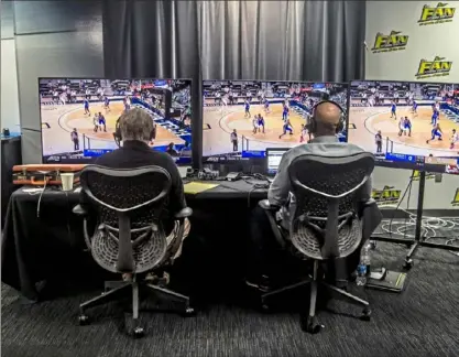  ?? Alexandra Wimley/Post-Gazette ?? TOP: Chris Shovlin has been doing Robert Morris games for 34 seasons, but never one such as this. ABOVE: Bill Hillgrove, left, and Curtis Aiken call the Pitt-Georgia Tech game played Feb. 14 in Atlanta from the Entercom studio in Green Tree.